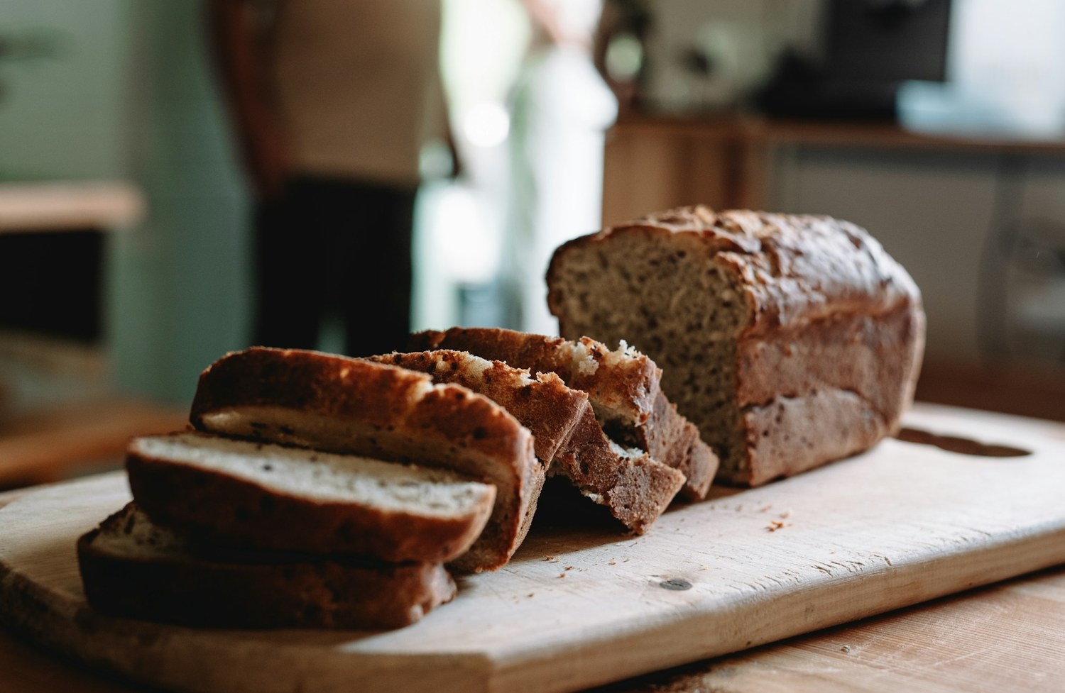 Slices of rustic bread on a wooden board